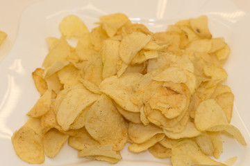 Pretzels chips crackers round yellow and delicious .