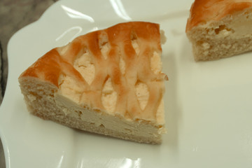 Sliced new york cheesecake tasty white yellow .