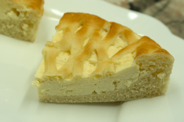 Tasty homemade cheesecake on grey table .
