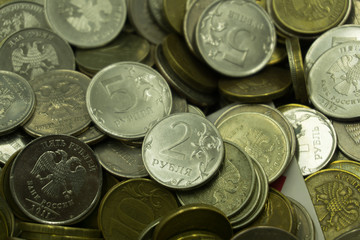 Yellow texture of a pile of small coins .