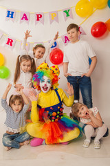 clown girl on the birthday of a child. Party for children. Play and entertain boys and girls