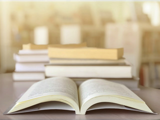 Open books on desk in the library. Education background
