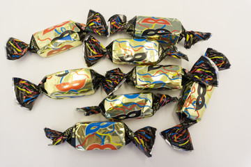 The concept of supply candy chocolate candy jelly mask .