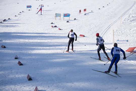 Cross country skiing in white winter nature. Original sport photo, winter game
