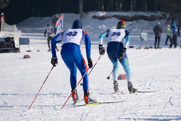 relay race ski resort people compete in their endurance .