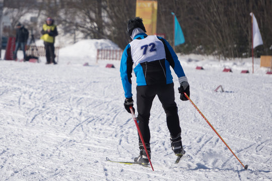 closeup of a male athlete skier during the race Les classic style in the championship .