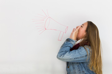 Blonde girl with hands on mouth shouting over red megaphone drawing on white board. Non conformist...