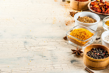 Set of various spices on light concrete background. Copy space.