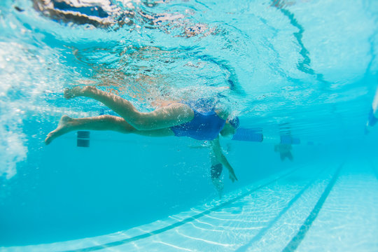 Girl Swimming Training Underwater Photo