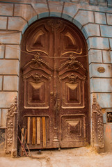 Old wooden door closeup on the street. Havana. Cuba