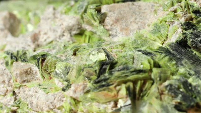 Macro view of Carnotite spinning collected from near Hanksville, Utah.