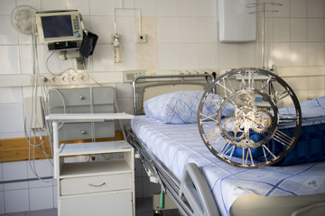 old mechanical clock on the background of medical chamber