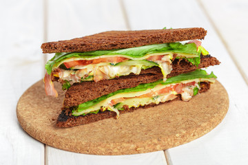 Club sandwich on wooden table