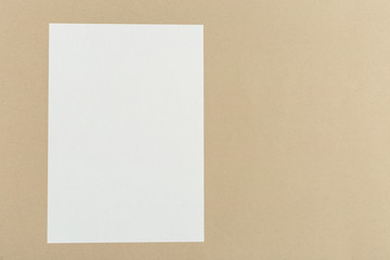 White business card on wooden table. Blank portrait A4.