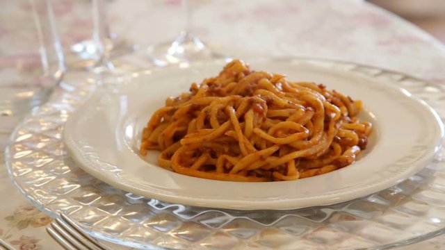 A Dish Of Pici Is Served At A Table