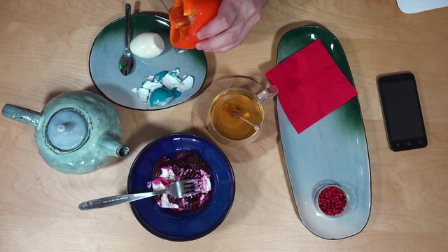 Top view with breakfast, tea, egg, salad and smartphone.