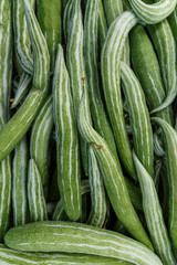 close up view of pile of green cucumbers