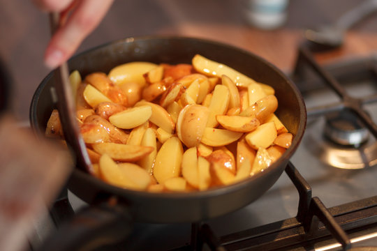 Cook frying new potatoes