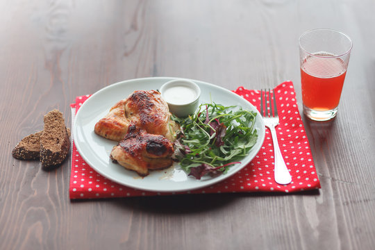 Fried chicken with salad, bread and juice