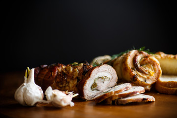Roll of meat with various spices and herbs