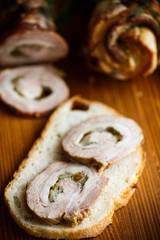 Roll of meat with various spices and herbs