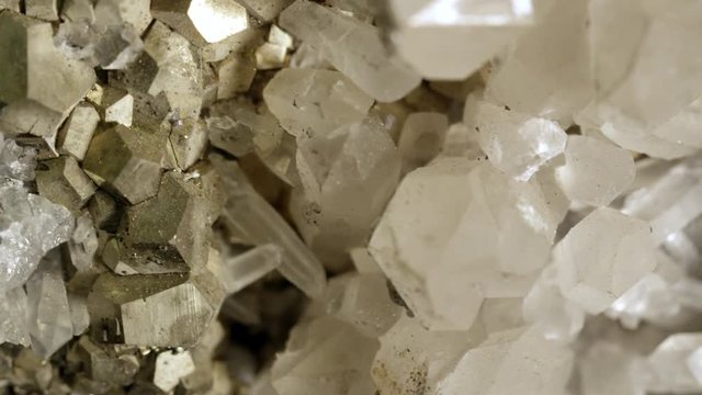 Macro view of light reflected on pyrite and quartz
