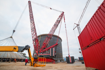 Construction of a production hall at a metallurgical plant factory with the help of a tower crane. © spaskov