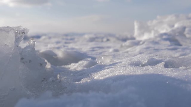 Dirty ice chunk in frozen sea. Dolly shot.