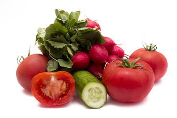 Fresh vegetables isolated on white.  Tomatoes, radish and cucumber. 