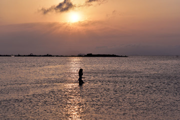 Attractive Woman Enjoying On The Sea At Sunset, Glyfada, Athens, Greece