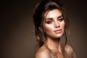 Naklejka premium Beautiful woman with professional make up and hairstyle