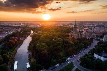 Beautiful red sunset in aerial view from Timisoara taken by a professional drone - Timișoara Orthodox Cathedral, Bega and Central Park