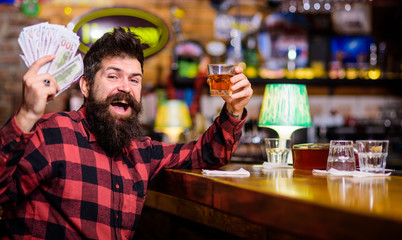 Alcohol drinks concept. Man with drunk face sit alone