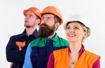 Team of architects, builders looking at same direction,