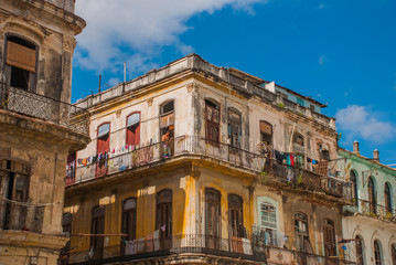 The view from the bottom up: a classic of the house and blue sky with clouds. Havana. Cuba