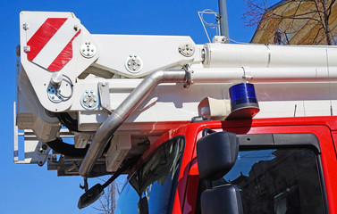 Fototapeta premium Ladder and pipes on a firefighter truck