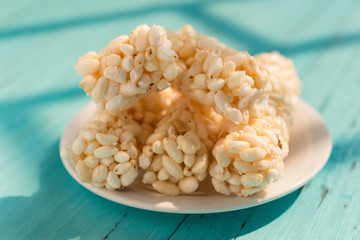 crisp rice rods on a dish in a sunny morning