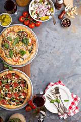 Margherita and pepperoni pizza with basil