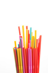 many colorful drink straws for drinks white background