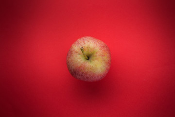 Apple red background top view