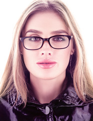 Vertical portrait face closeup. Beautiful young woman wearing glasses. Perfect face and long flowing hair