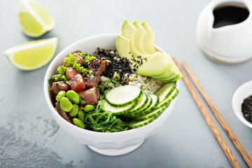 Poke bowl with raw tuna, rice and vegetables