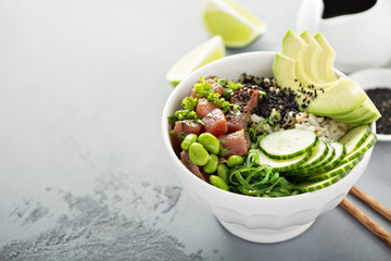 Poke bowl with raw tuna, rice and vegetables