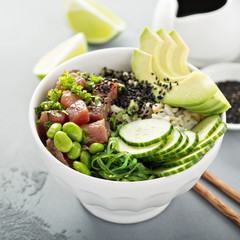 Poke bowl with raw tuna, rice and vegetables