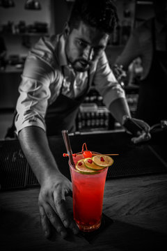 Bartender serving cocktail