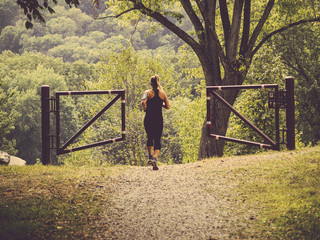 Young Female Jogger in a Park Setting