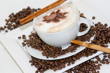Good Morning: Cup of latte art coffee with coffee beans :)
