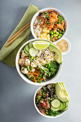 Variety of poke bowls with tuna, salmon and tofu