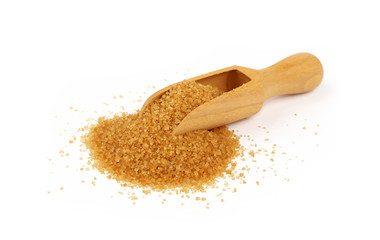 Wooden scoop spoon full of brown cane sugar