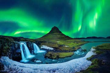 Northern Light, Aurora borealis at Kirkjufell in Iceland. Kirkjufell mountains in winter. - obrazy, fototapety, plakaty